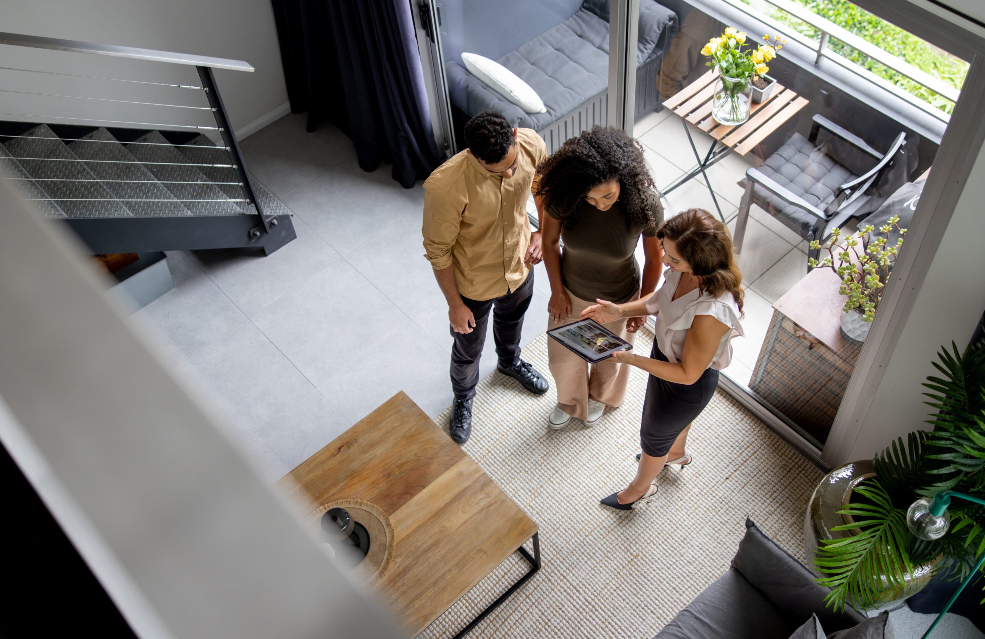 Realtors helping buyers review Montgomery home listings online.