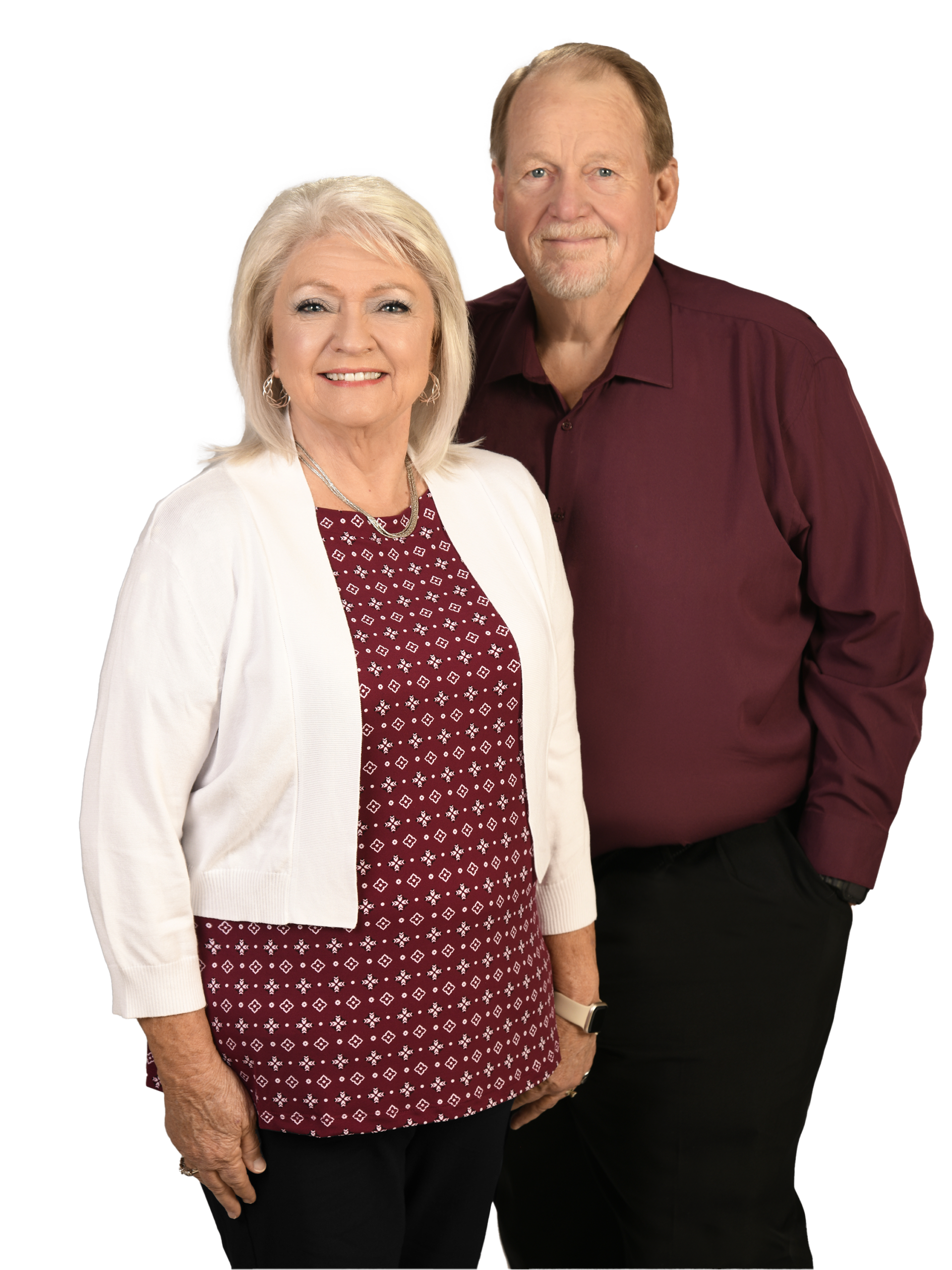 Smiling senior couple posing in studio