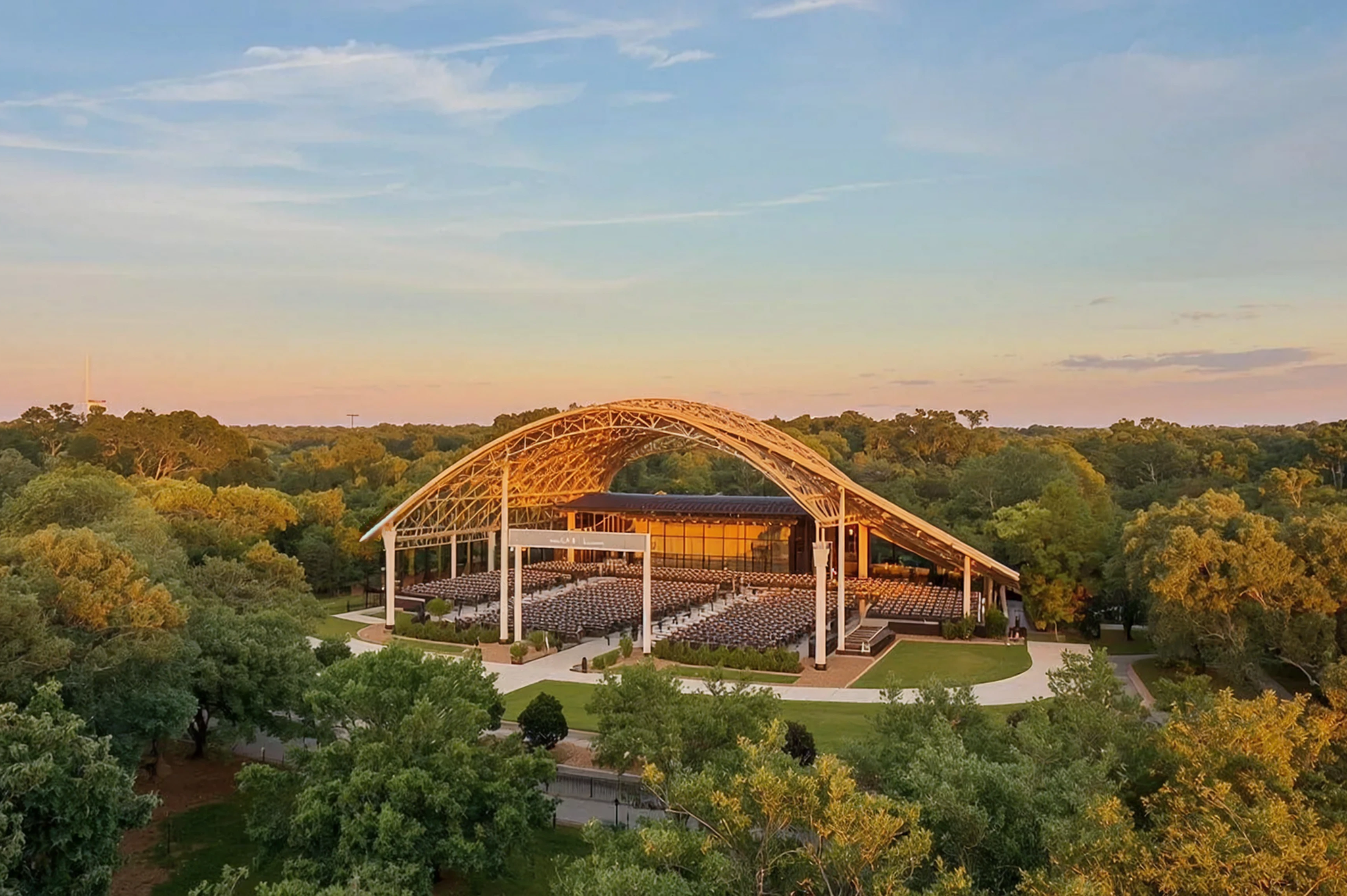 Open-air amphitheater with arched wooden roof