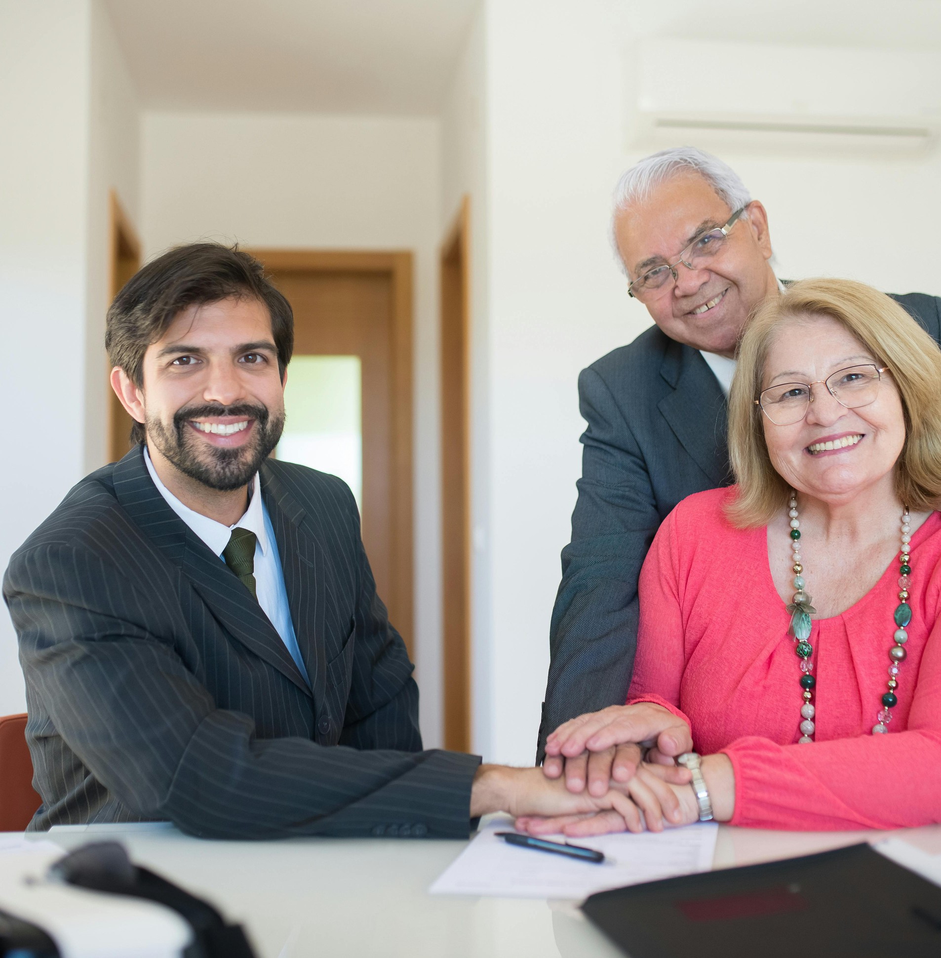 Financial advisor with smiling senior couple