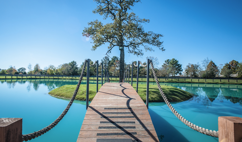 Wooden footbridge to tree-covered island