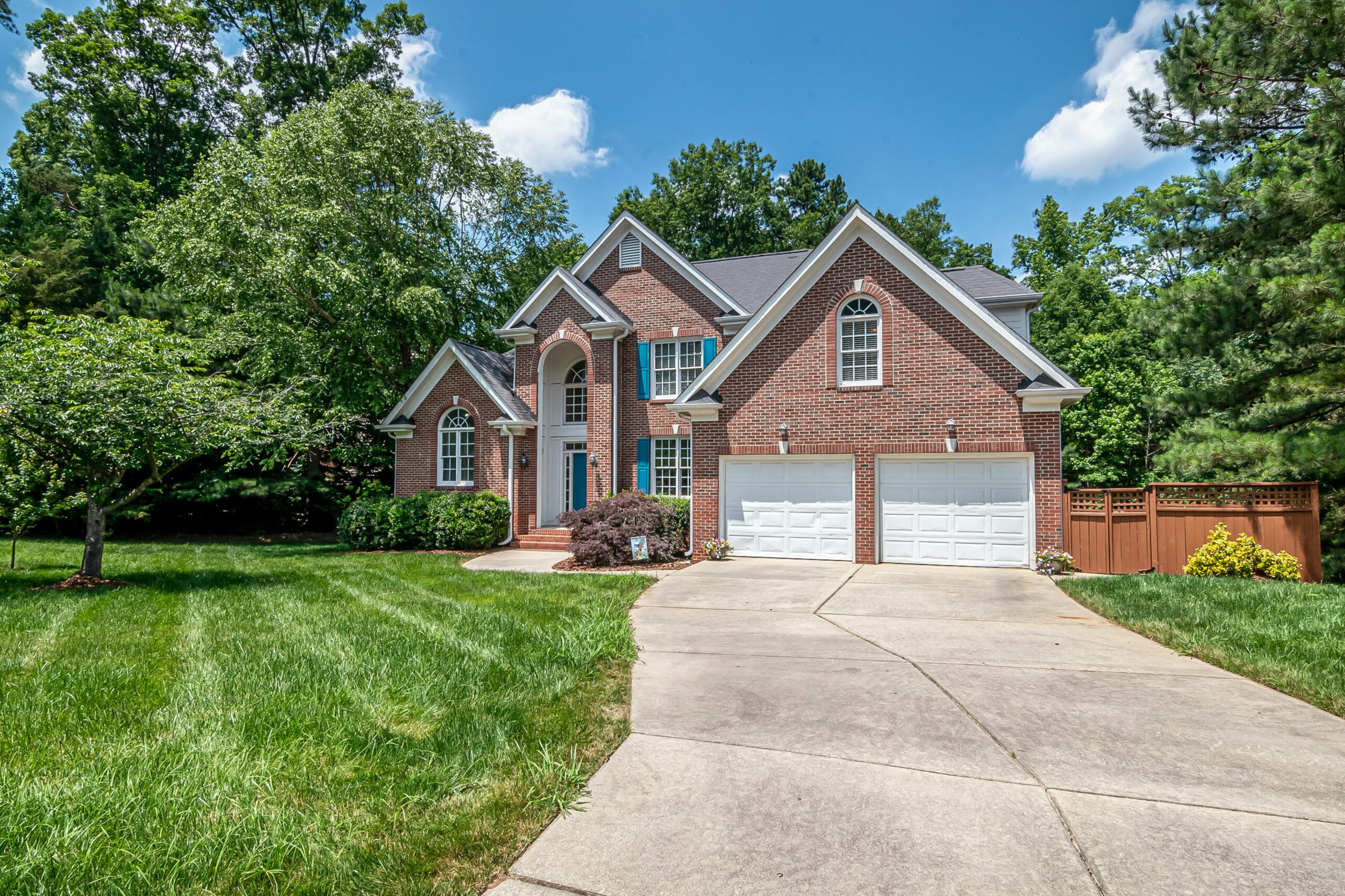 Two-story brick suburban house with double garage