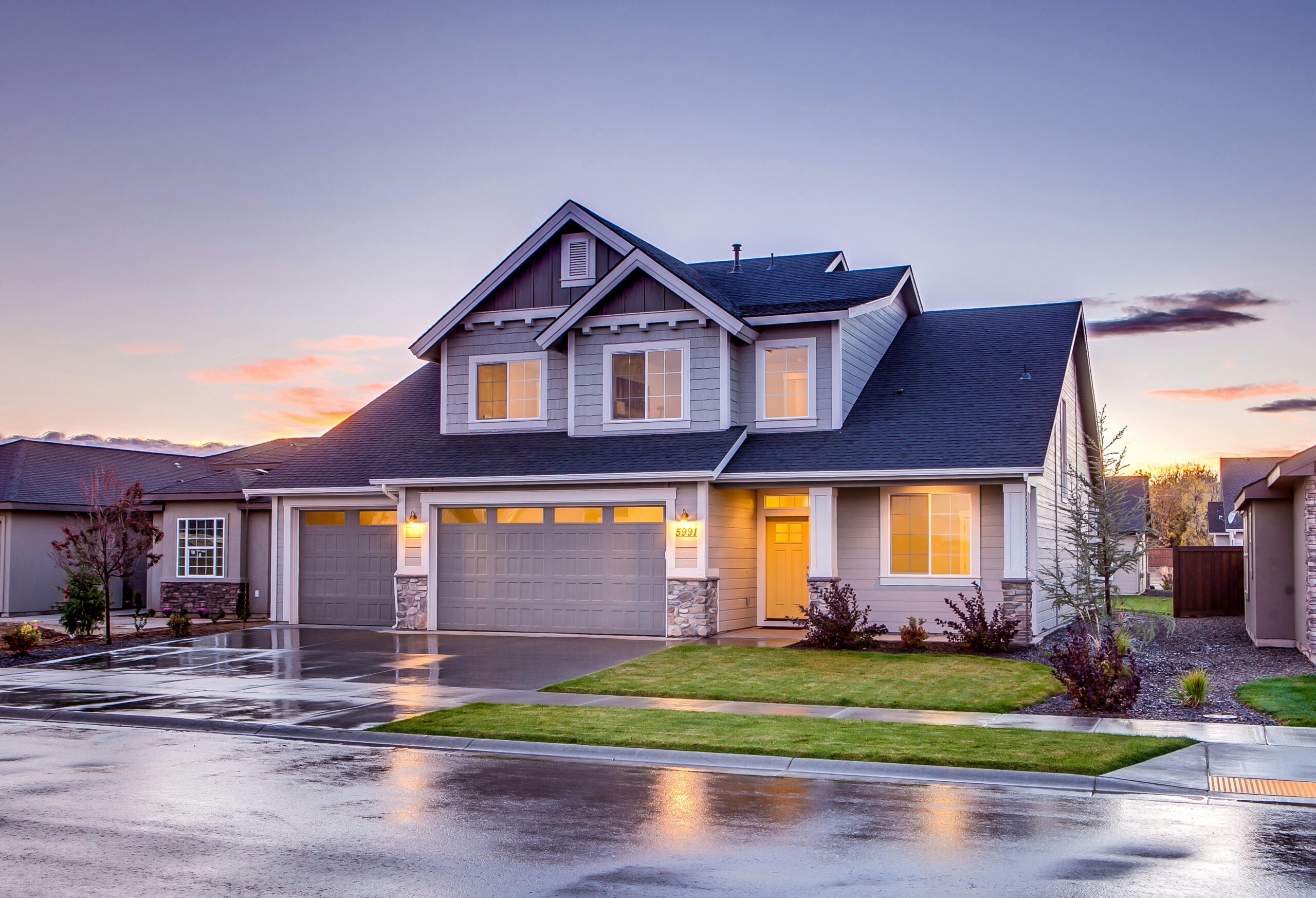 Modern two-story suburban house at dusk