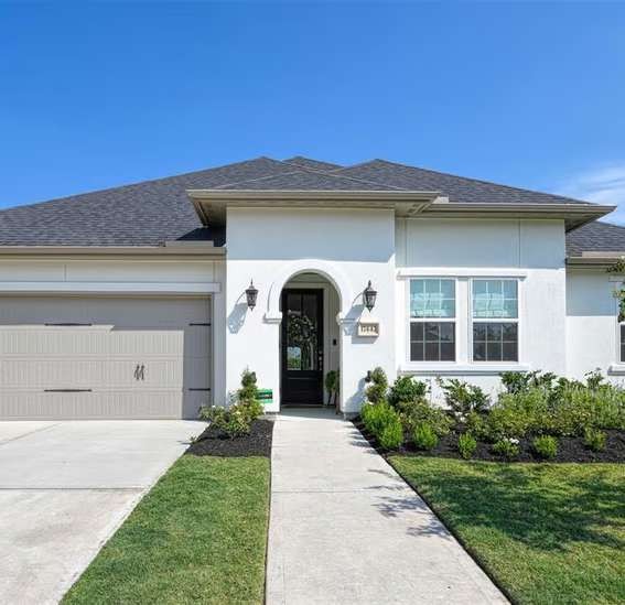 Front entrance of modern white suburban house