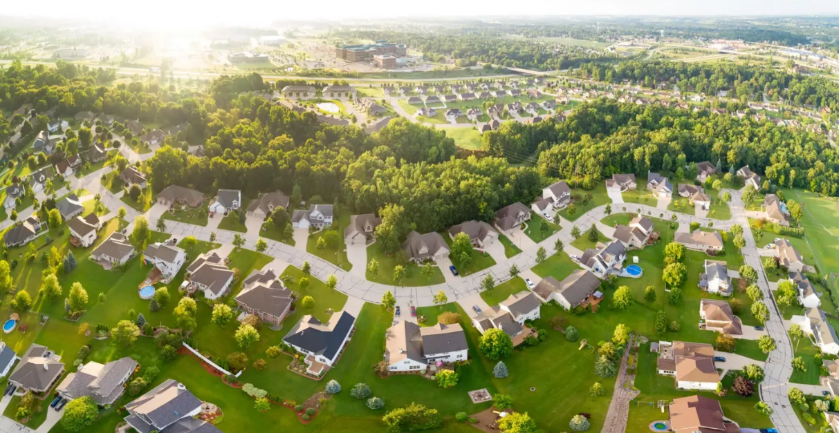 Aerial view of suburban neighborhood with winding streets